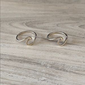 Two Pura Vida wave rings.